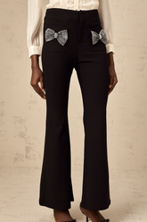 Gelsomina Studded Bow-Detail Flared Trousers — Black