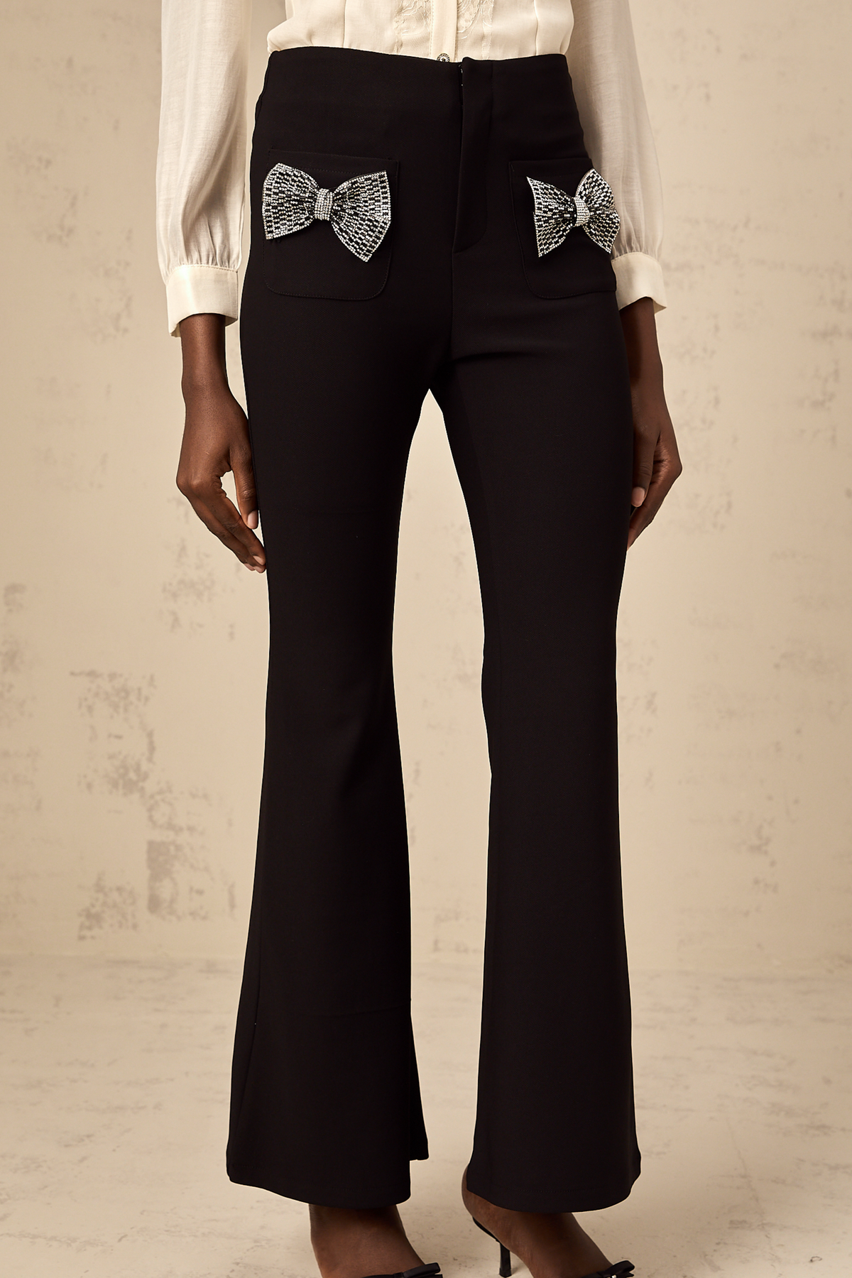 Gelsomina Studded Bow-Detail Flared Trousers — Black