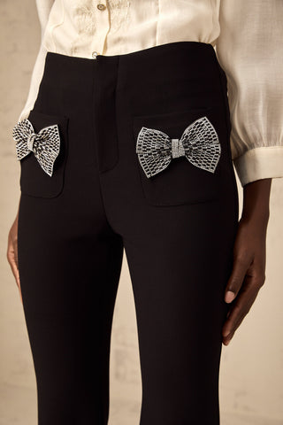 Gelsomina Studded Bow-Detail Flared Trousers — Black